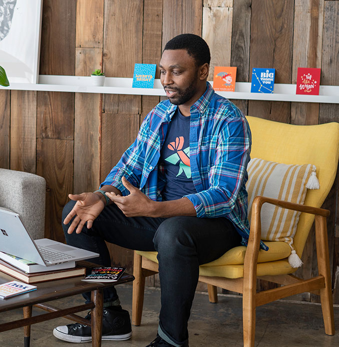 Man Sitting on Chair Having a Video Call